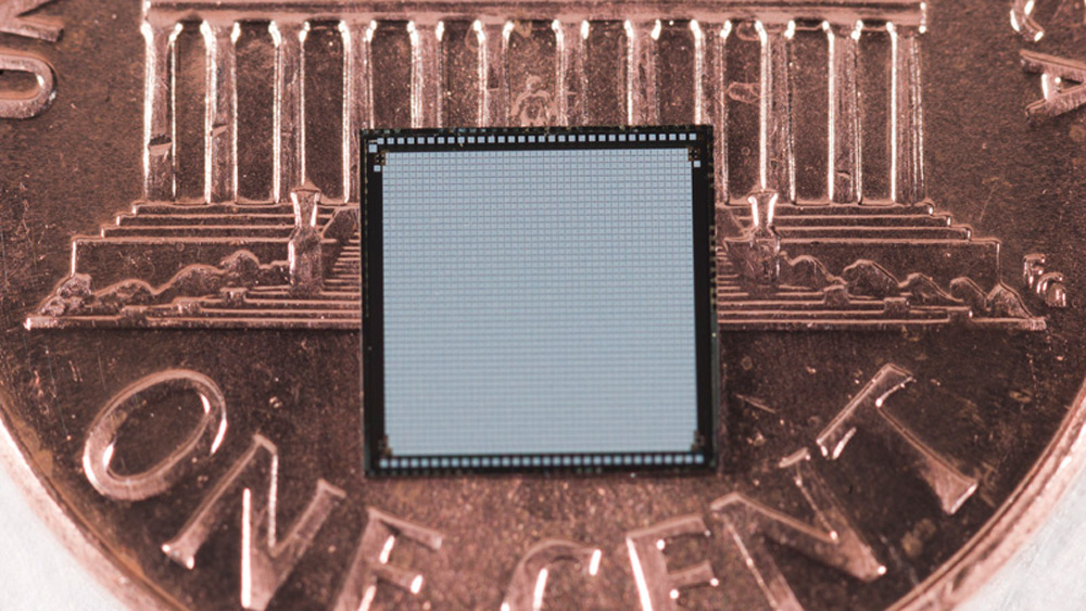Photo of three-dimensional integrated chip on penny