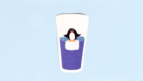 Illustration of penguin at the top of water glass on top of ice cube