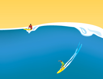 Surfers riding waves