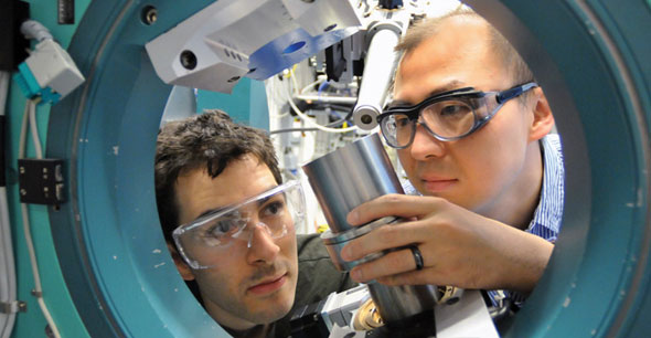 University of Chicago scientist Rafael Jaramillo and Argonne scientist Yejun Feng examine the element chromium at the Advanced Photon Source. - accelerator_chicago