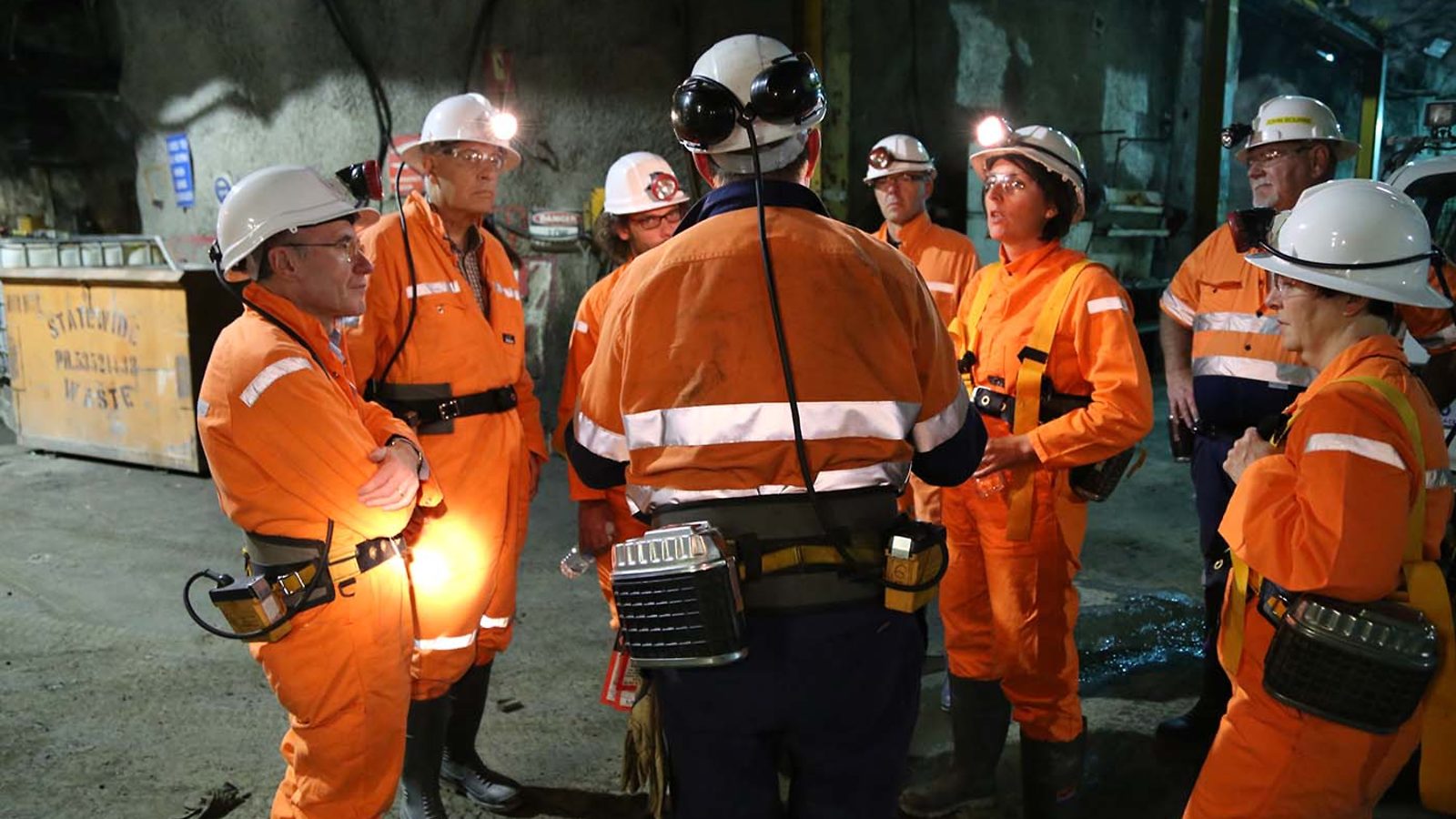 Rob Stewart of the Stawell Gold Mine (center, back turned), talks to scientists during a tour of the mine.