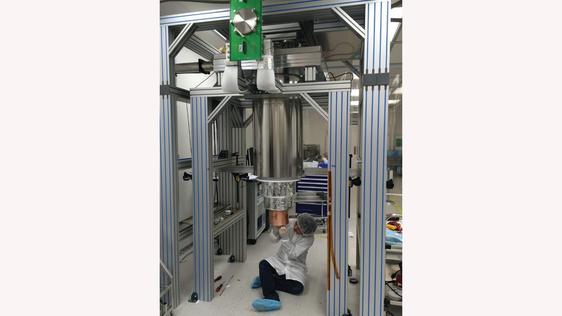SLAC's Tsuguo Aramaki is completing the assembly of the dilution fridge test facility in Building 33 at SLAC.