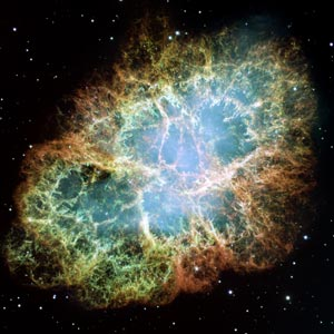 Fermi's Large Area Telescope has recently detected two short-duration gamma-ray pulses coming from the Crab Nebula, which was previously believed to emit radiation at very steady rate. The pulses were fueled by the most energetic particles ever traced to a discrete astronomical object. (Image courtesy NASA/ESA.) 
