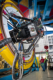 A replica ring of the top-end  of the Blanco telescope  allowed technicians at  Fermilab to test the  installation of a 570-megapixel  camera and check how camera  parts would function as the  telescope rotates. This testing  significantly reduces the amount  of telescope down time that will  be required during the assembly  in Chile.