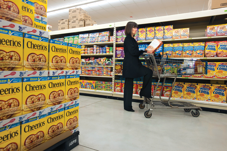Photo of woman in cereal isle of grocery store