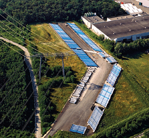 Hundreds of blue dipole magnets sit outside the magnet test facility waiting for installation in the LHC tunnel.