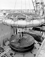 The magnet moves again. Its new home, named the New Muon Lab, is constructed around it.