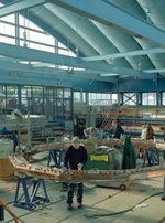 In the Meson Detector Building (above), a technician inspects the superconducting coils that will be used to power the up- graded magnet.