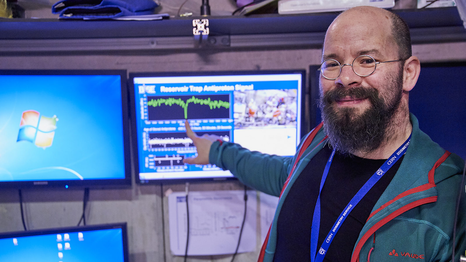 Stefan Ulmer, spokesperson of BASE collaboration, points at a screen with data about a 405-day-old antiproton