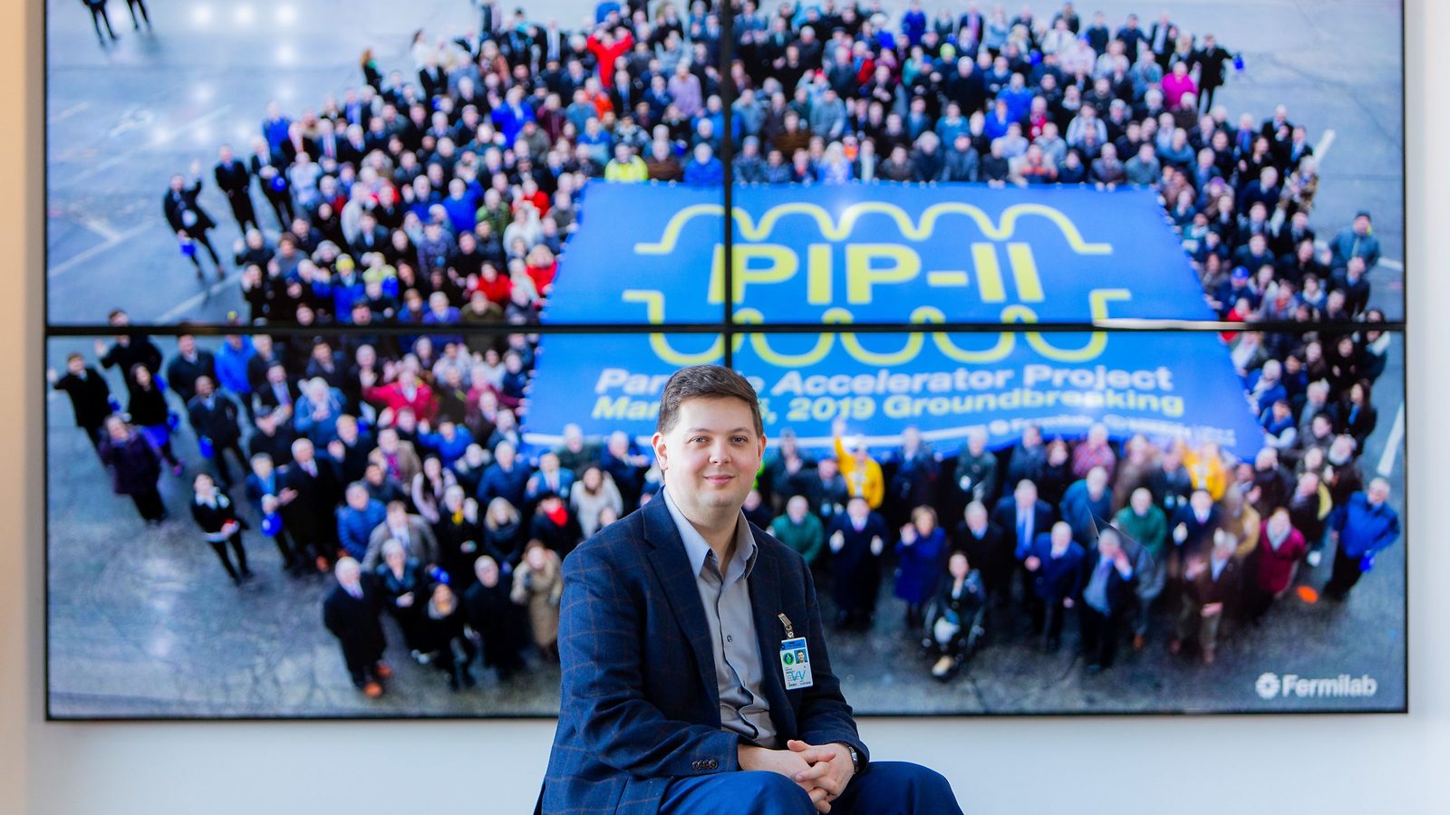 David Ibbett in front of a PIP-II background
