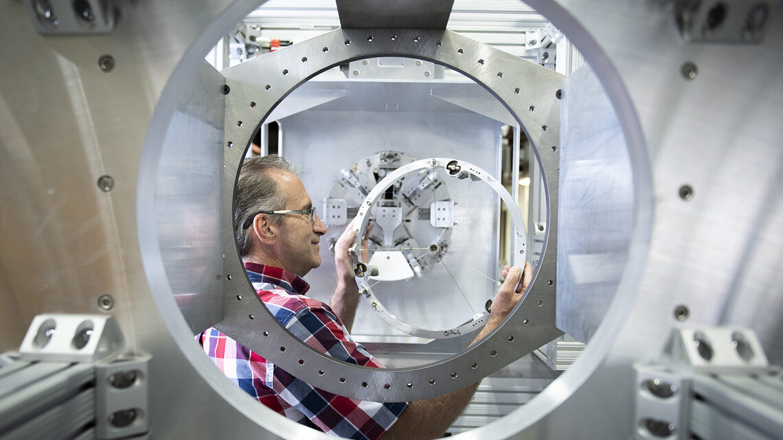 Fermilab engineer Mike Campbell handles the target for the Mu2e experiment.