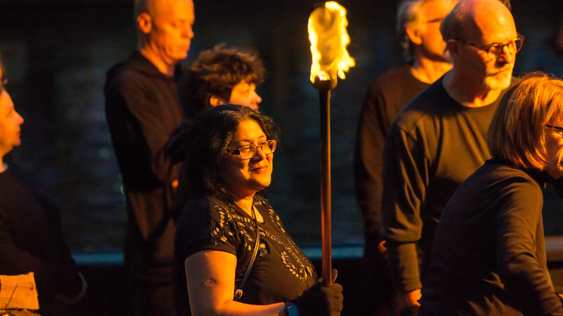 Brown University physicist and organizer of the Big Bang Science Fair Meenakshi Narain stands with a lit torch