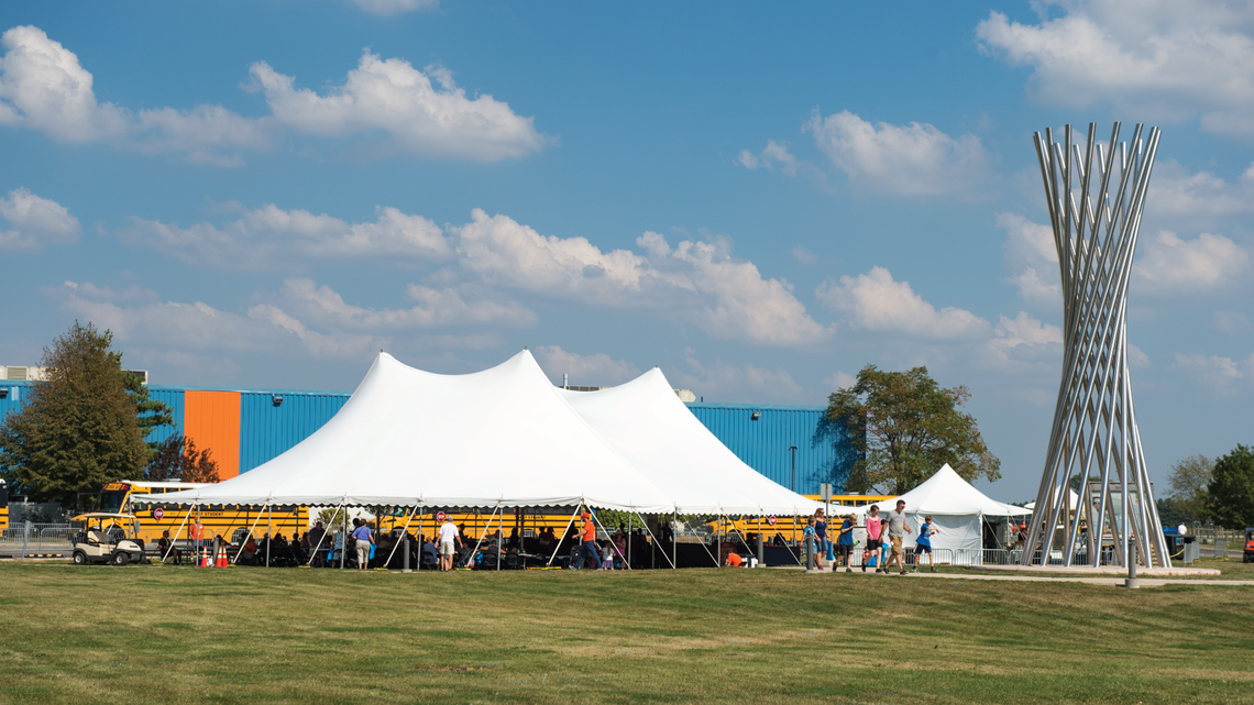 Tents erected for the celebration provided welcome shade from which to view the campus, including the tall Tractricious sculptur