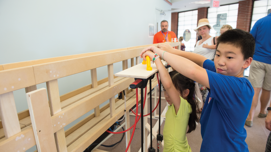 Hundreds of young scientists experimented with hands-on demos at the Lederman Science Center.
