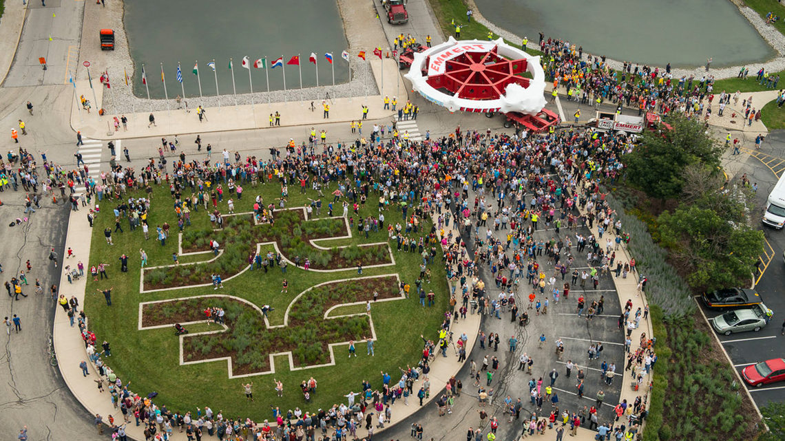 Photo of a crowd of thousands gathered outside Fermilab’s Wilson Hall on July 26 to welcome the Muon g-2 ring