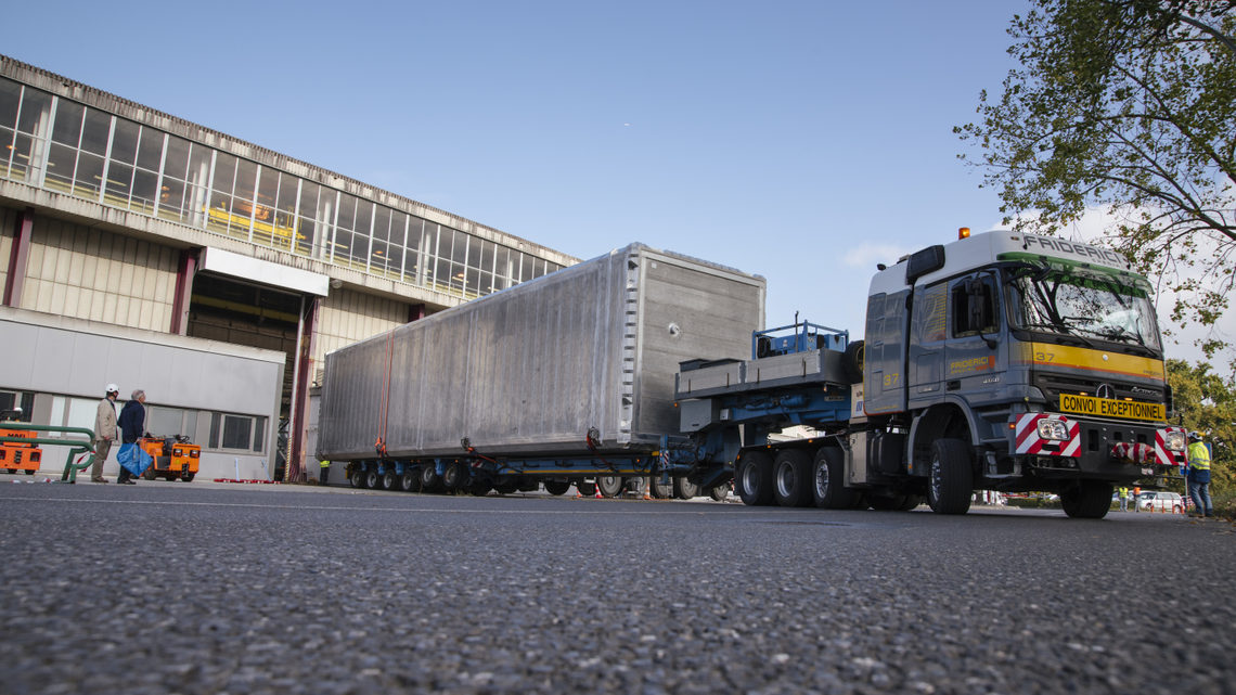 The ICARUS detector being transported by truck to another location at CERN.