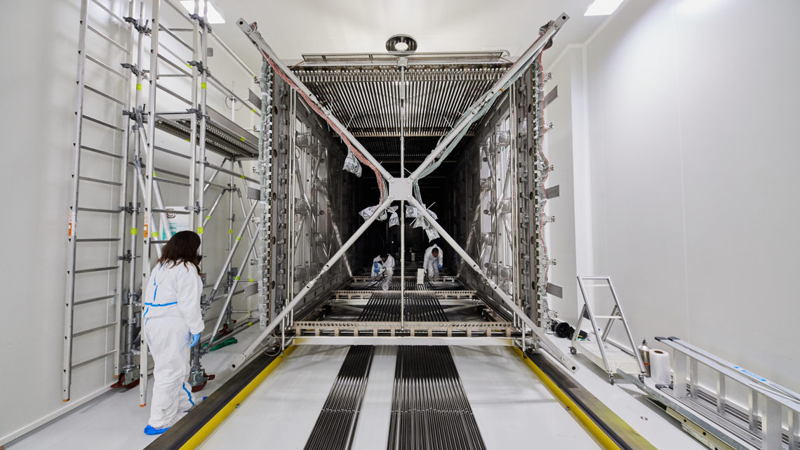 Photograph of the ICARUS detector being loaded into its cryostat at CERN