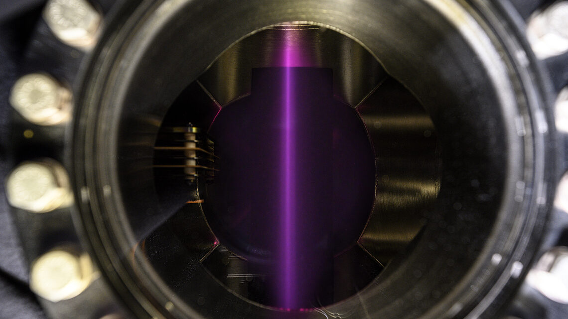  Photo of purple beam of light inside the Linac4 ion source test stand