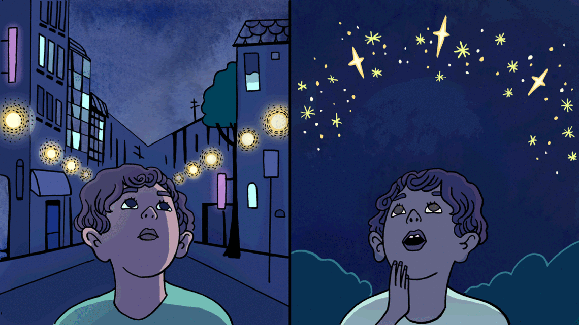Two boys look up to night sky to see a river of stars