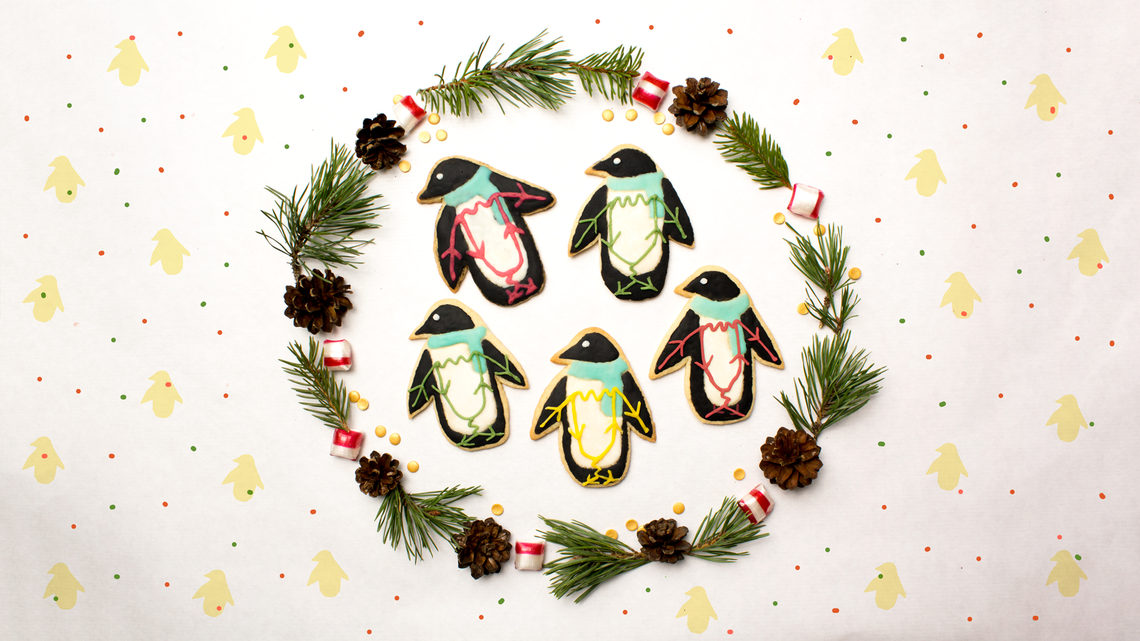 Penguin cookies, inside wreath with polka dot background