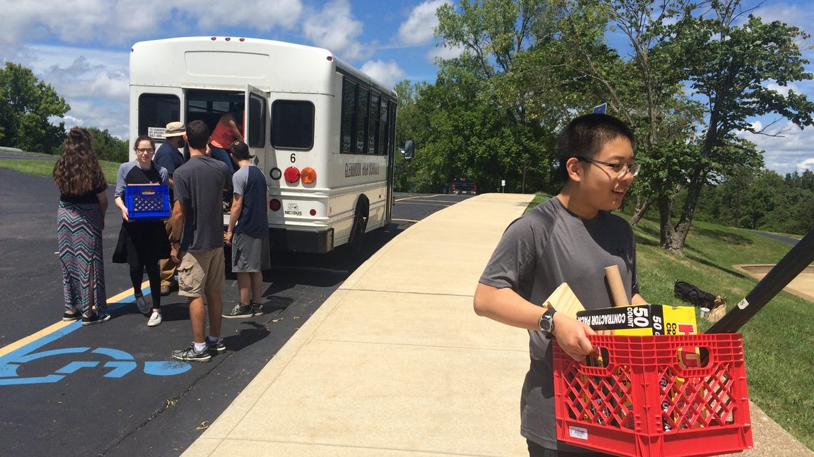 Photo of Glenbrook North High School students unloading bus