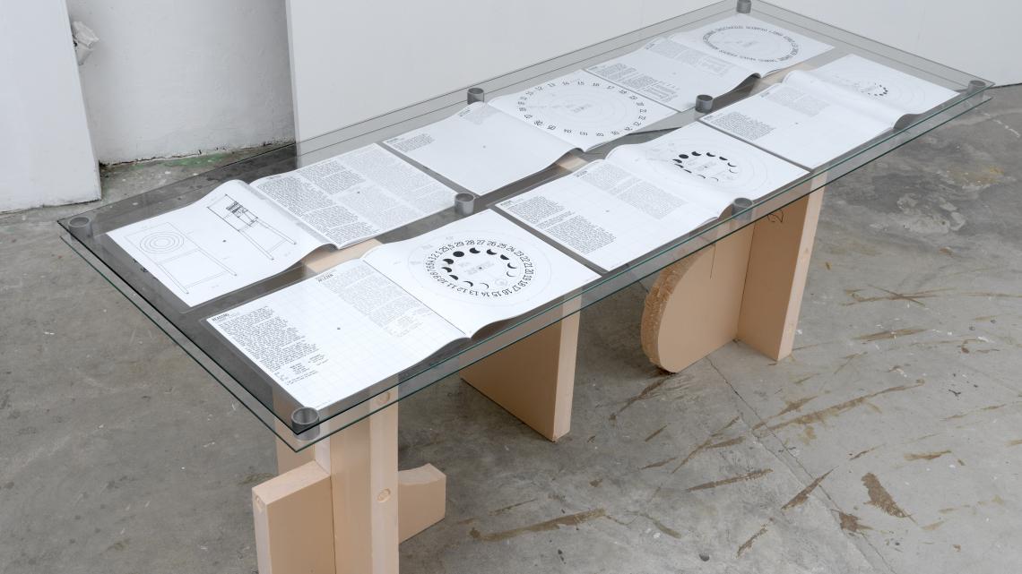 Photograph of printed manuals open on a table