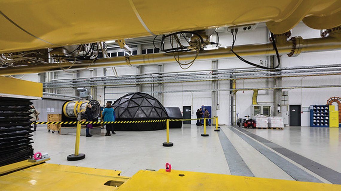 Photo of yellow and grey machinery in industrial space