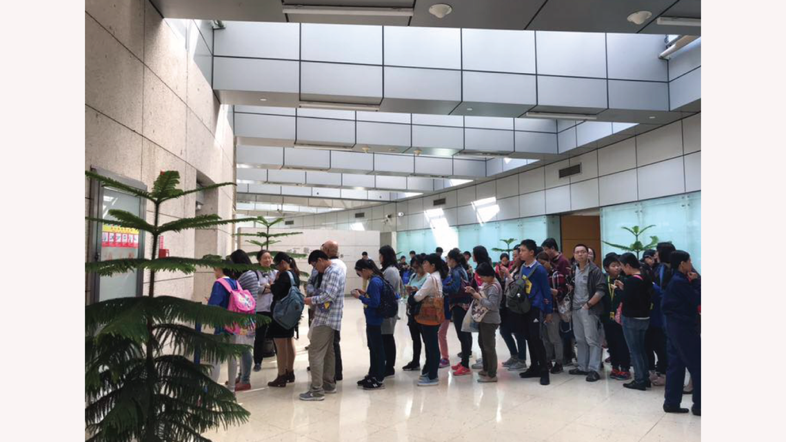 Photo of visitors lining up outside the Dark Matter Day event in Shanghai