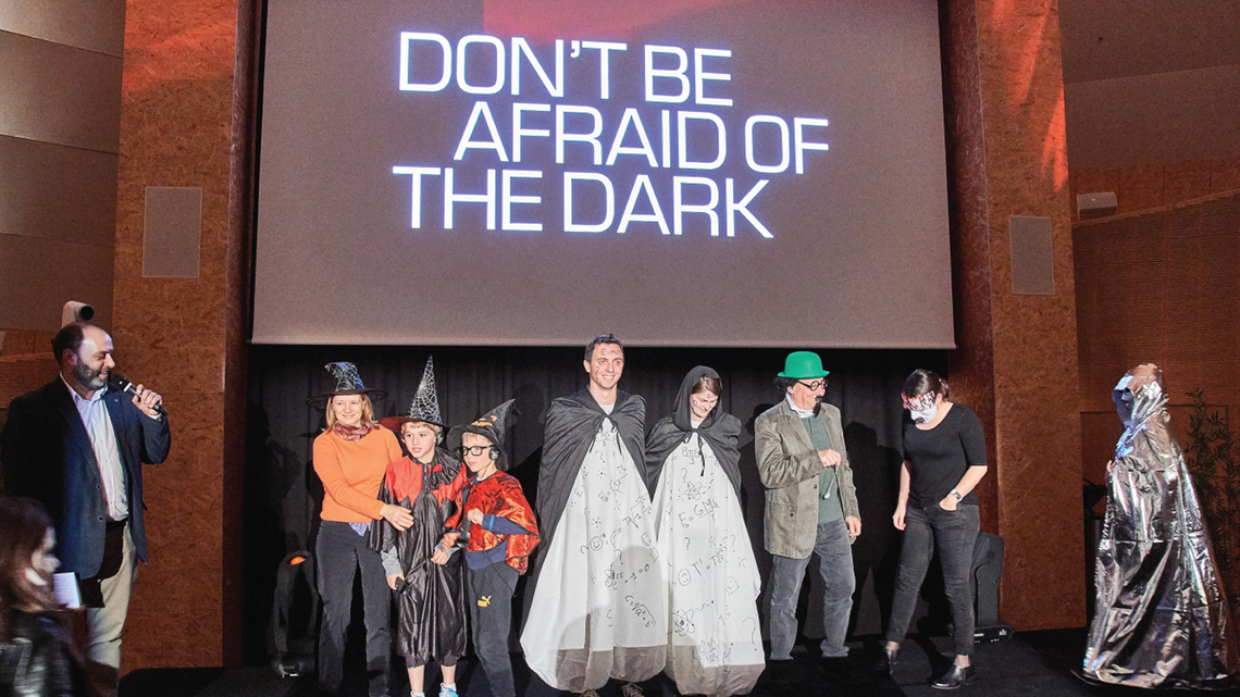 Photo of some creative participants dressed up in costumes related to dark matter