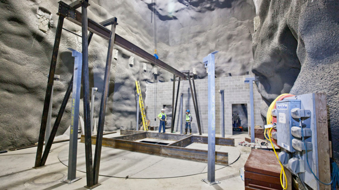Photo of construction workers built the water tank starting from the top